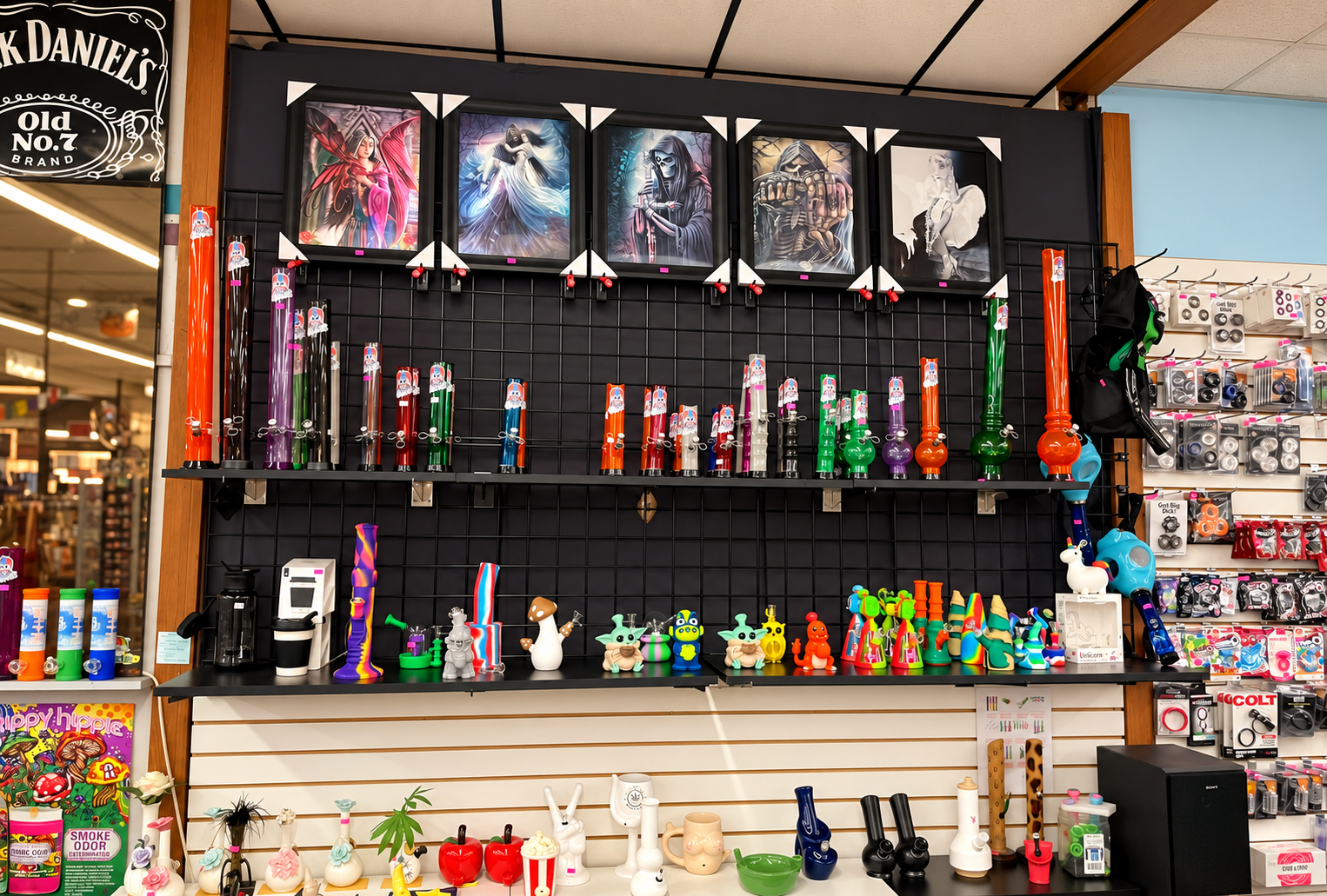 Glass Eye display wall with artwork, glass, and accessories